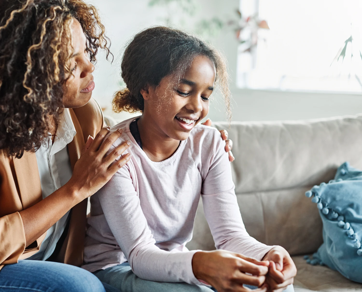 Mother with her teenage daughter at meeting with social worker