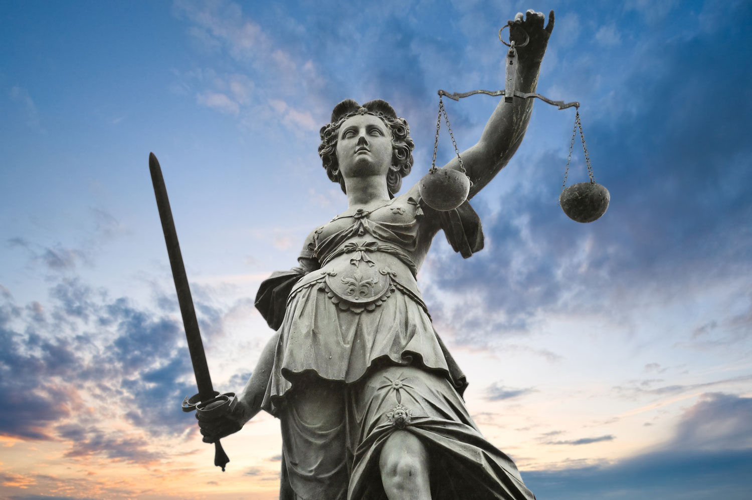justice statue with sword and scale.